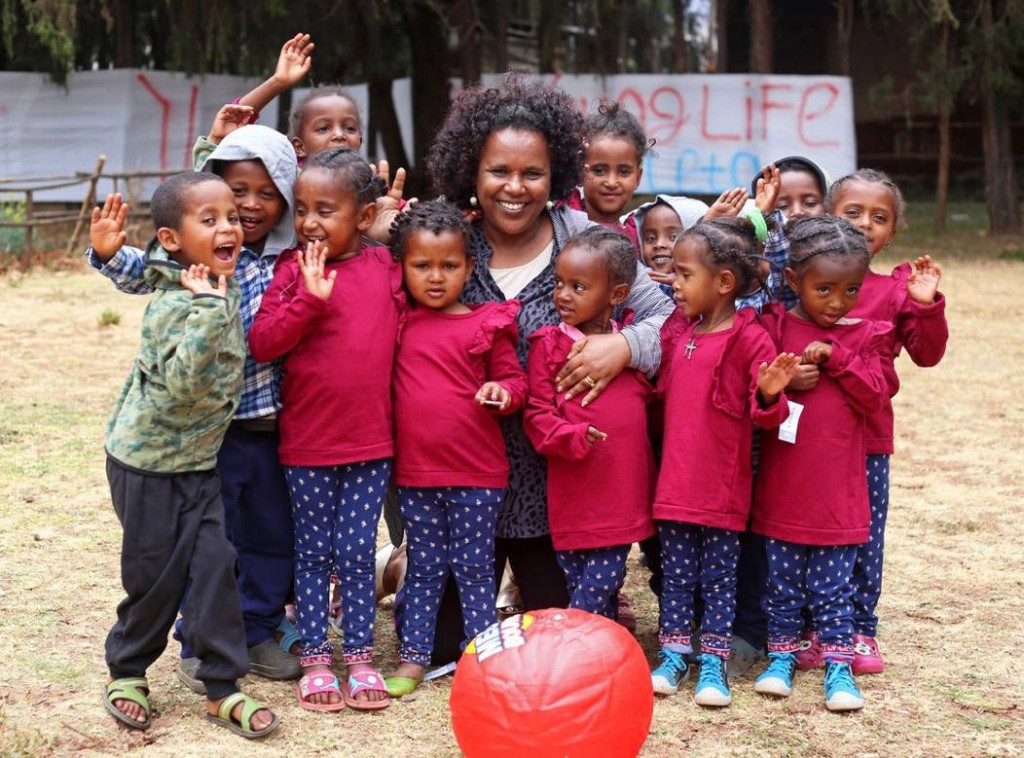 Children and caregivers celebrating together in Ethiopia