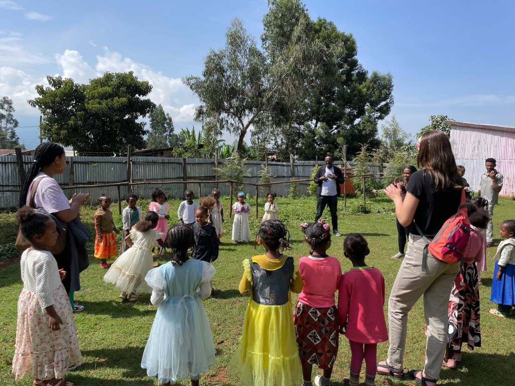 Mission trip volunteers leading an outdoor activity with children in Ethiopia